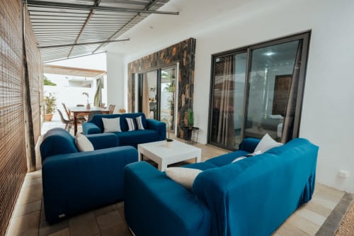 Blue modern sofas with white coffee table in Summer of Hope villa living area, Pereybere, Mauritius