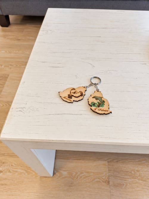 Wooden keychains on white dining table at Ti Palmier apartment, Flic-en-Flac