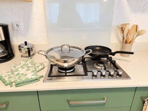 Kitchen stovetop setup at Gerards & Angel apartment in Flic-en-Flac with cookware and utensils