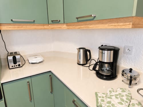 Kitchen counter at Gerards & Angel apartment with kettle, coffee maker, and appliances in Flic-en-Flac