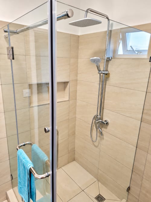 Modern shower enclosure with rainfall showerhead and handheld spray at Ti Palmier apartment, Gerards & Angel, Flic-en-Flac