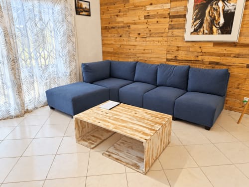Modern living room at Gerards & Angel apartment with blue modular sofa and wooden coffee table in Flic en Flac