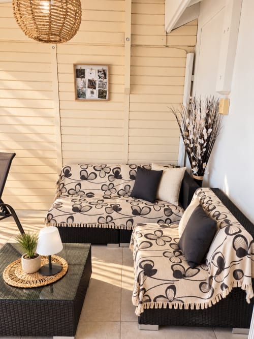 Cozy bungalow seating area at Les Balcons D'Oyster Pond, Saint-Martin with patterned outdoor sofas and terrace decor