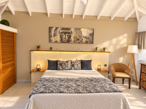 Bungalow bedroom at Les Balcons D'oyster Pond, Saint-Martin with queen bed, illuminated headboard, and tropical decor