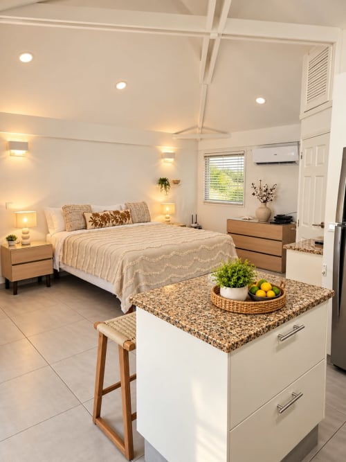 Modern bedroom with kitchenette at Les Balcons D'oyster Pond bungalow, Saint-Martin. Beige decor, queen bed, equipped