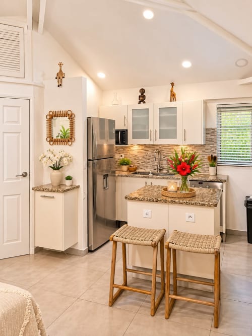 Modern equipped kitchen in Bungalow 5 at Les Balcons D'oyster Pond, Saint-Martin with white cabinets, granite counters, and