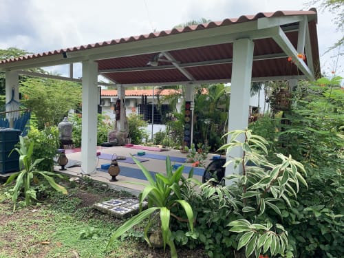 Yoga studio pavilion at El Litoral Panama BnB with tropical plants and exercise mats in Costa Esmeralda