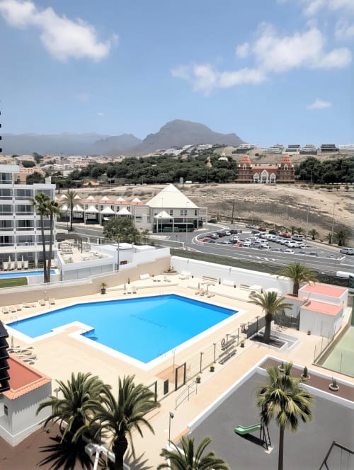 Luxury apartment pool with sea view in Costa Adeje, Tenerife, overlooking mountains