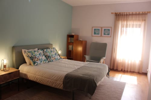 Bright bedroom at Seahorse House by Break Lovers in Tavira with queen bed, sitting area, and natural light from balcony doors