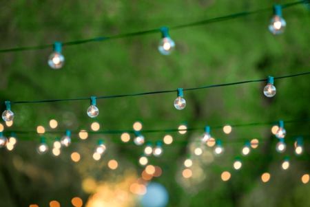 Even in a small backyard, composite decking and exterior lighting can help you live large.