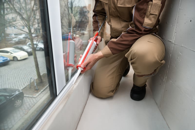 Seal cracks by caulking the windows.