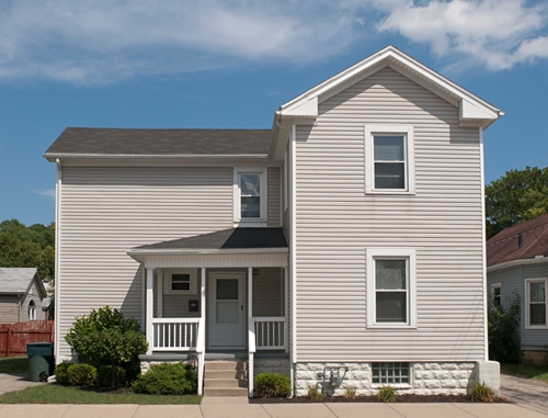 Using consistent siding can make a home look whole.