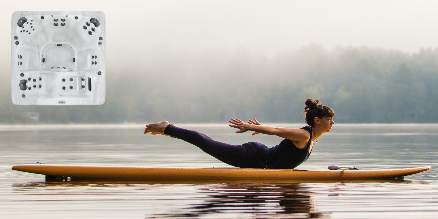 A lady exercising on a boat in the middle of water