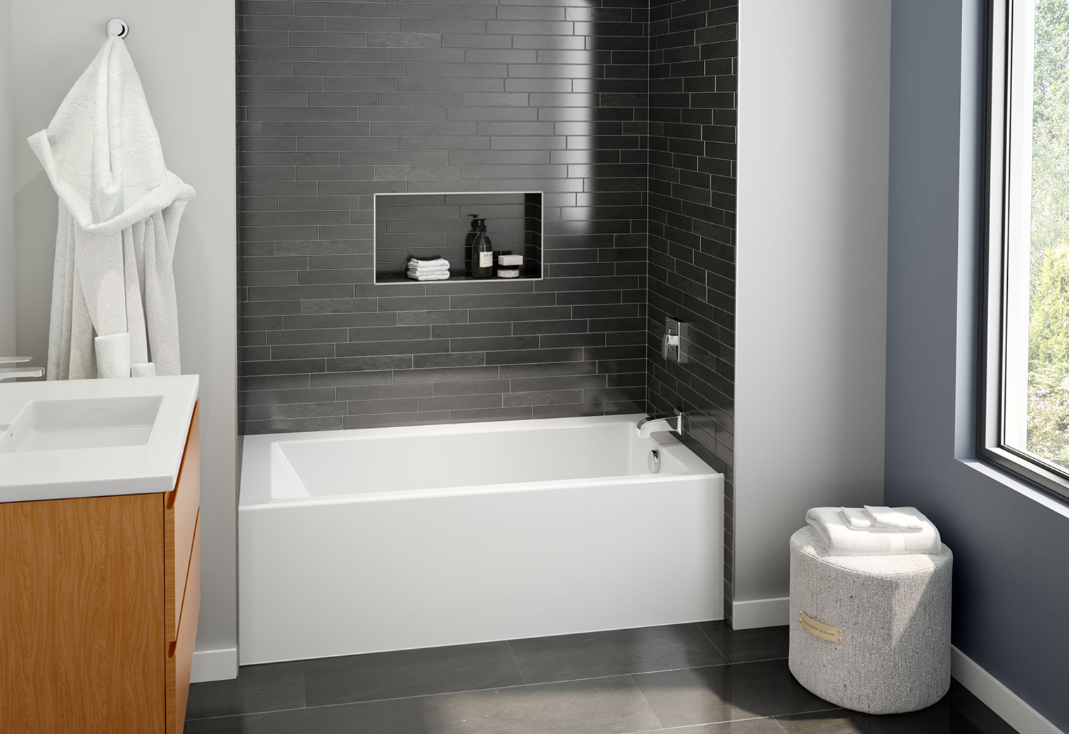 Bathtub with black subway tile on the shower walls.