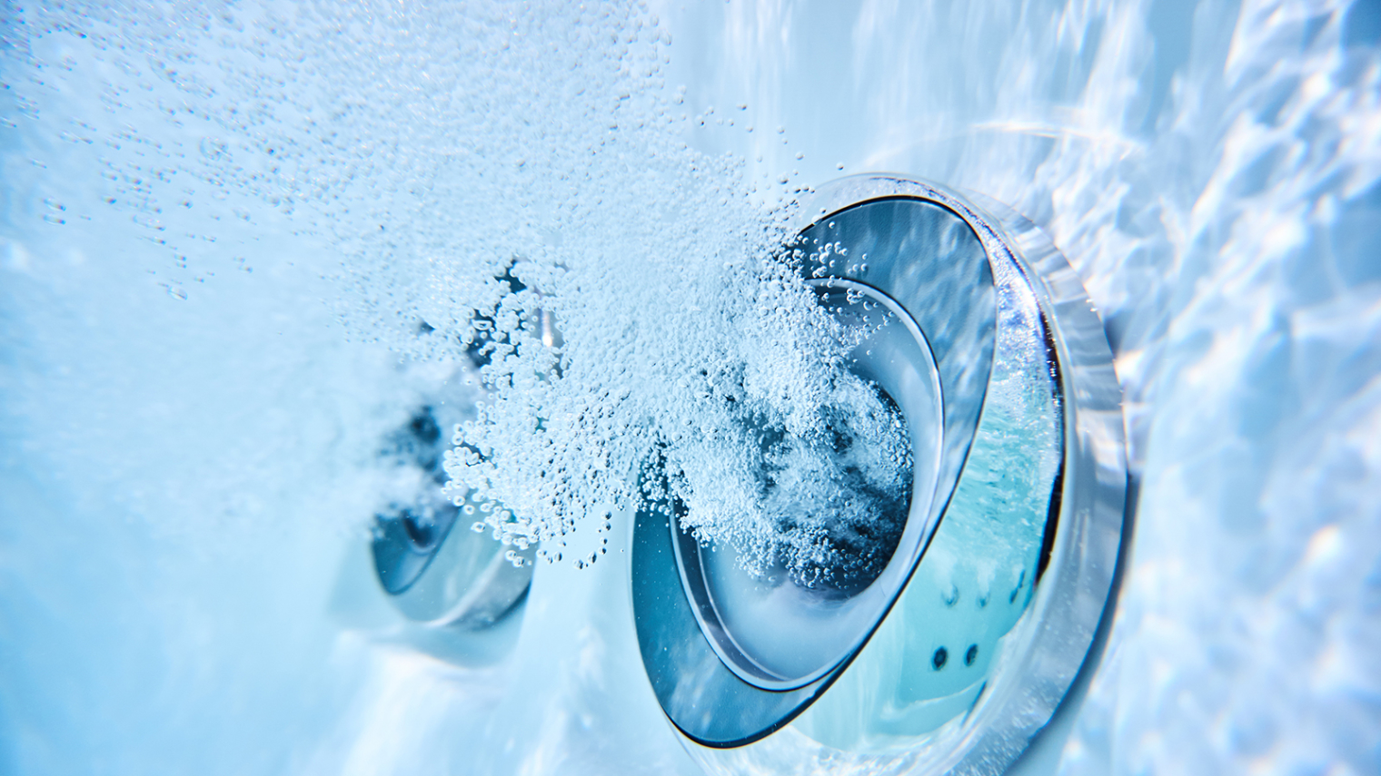 Image of a jet blowing underwater.