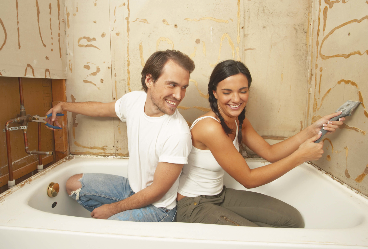 A couple renovating their bathroom.