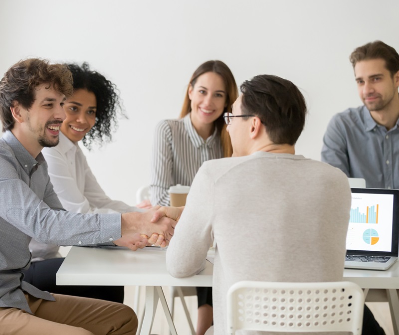 Group of workers collaborating at conference table