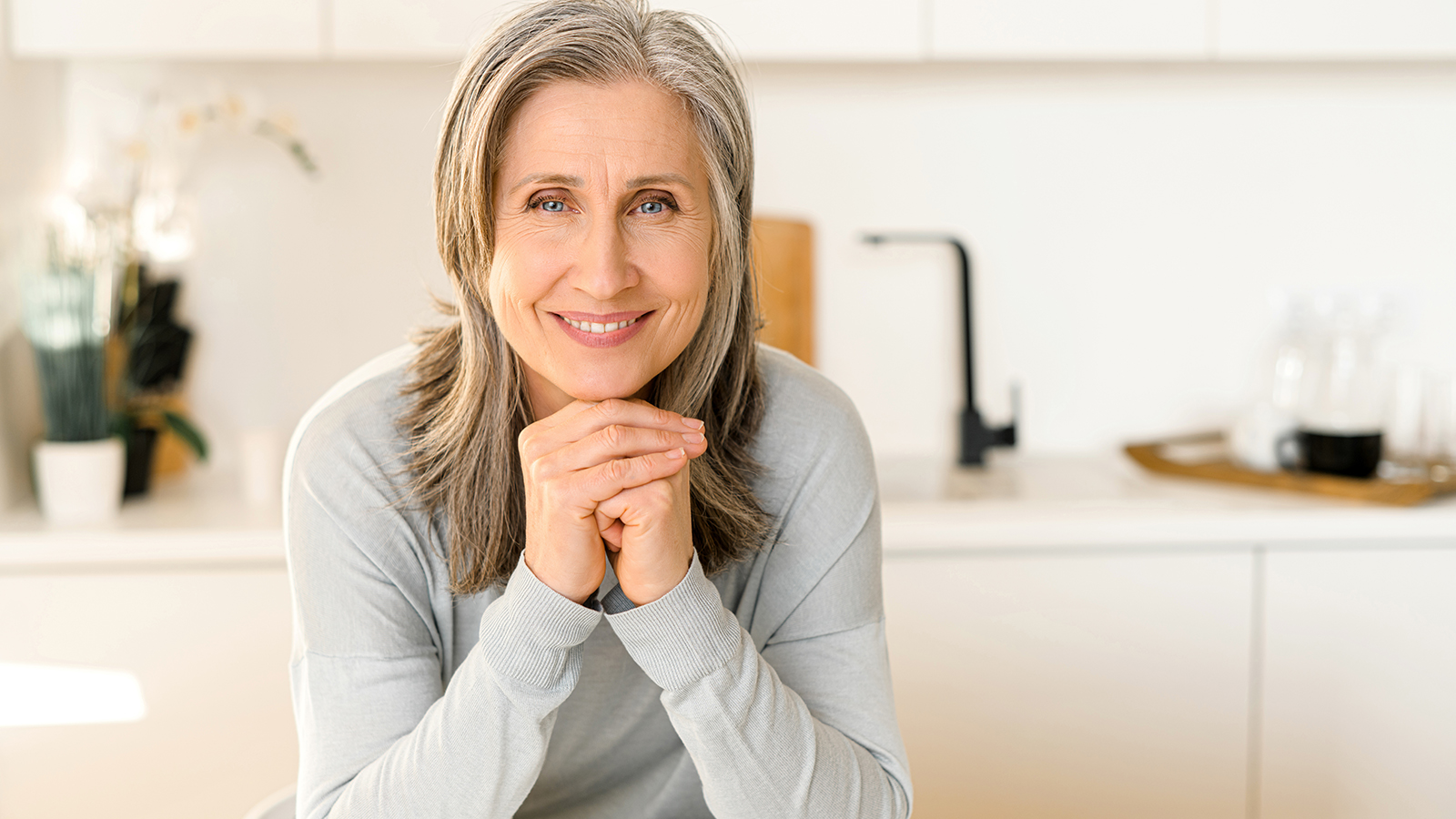 Image of a middle-aged woman smiling.