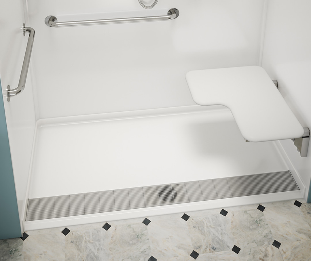 Center drain shower base with marble tile and bathroom floor mat in front of the shower.