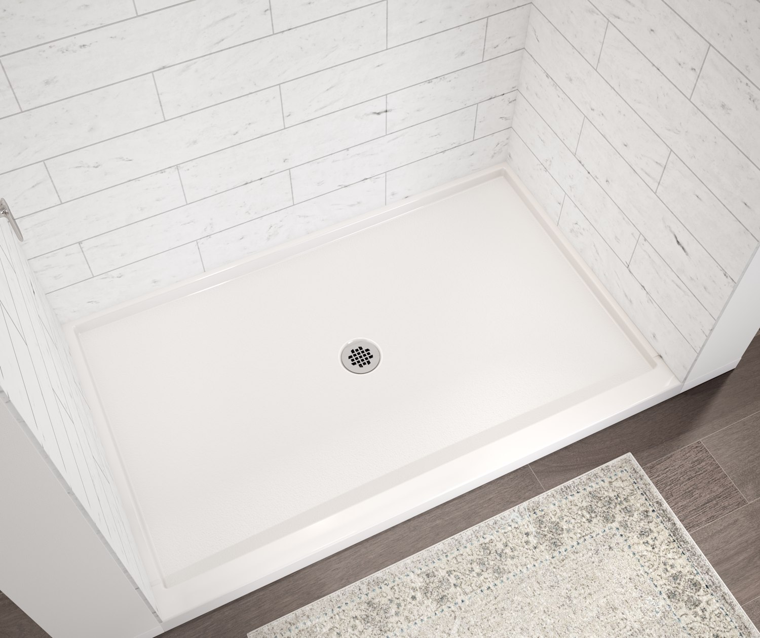 Trench drain shower pan with an accessible shower seat.