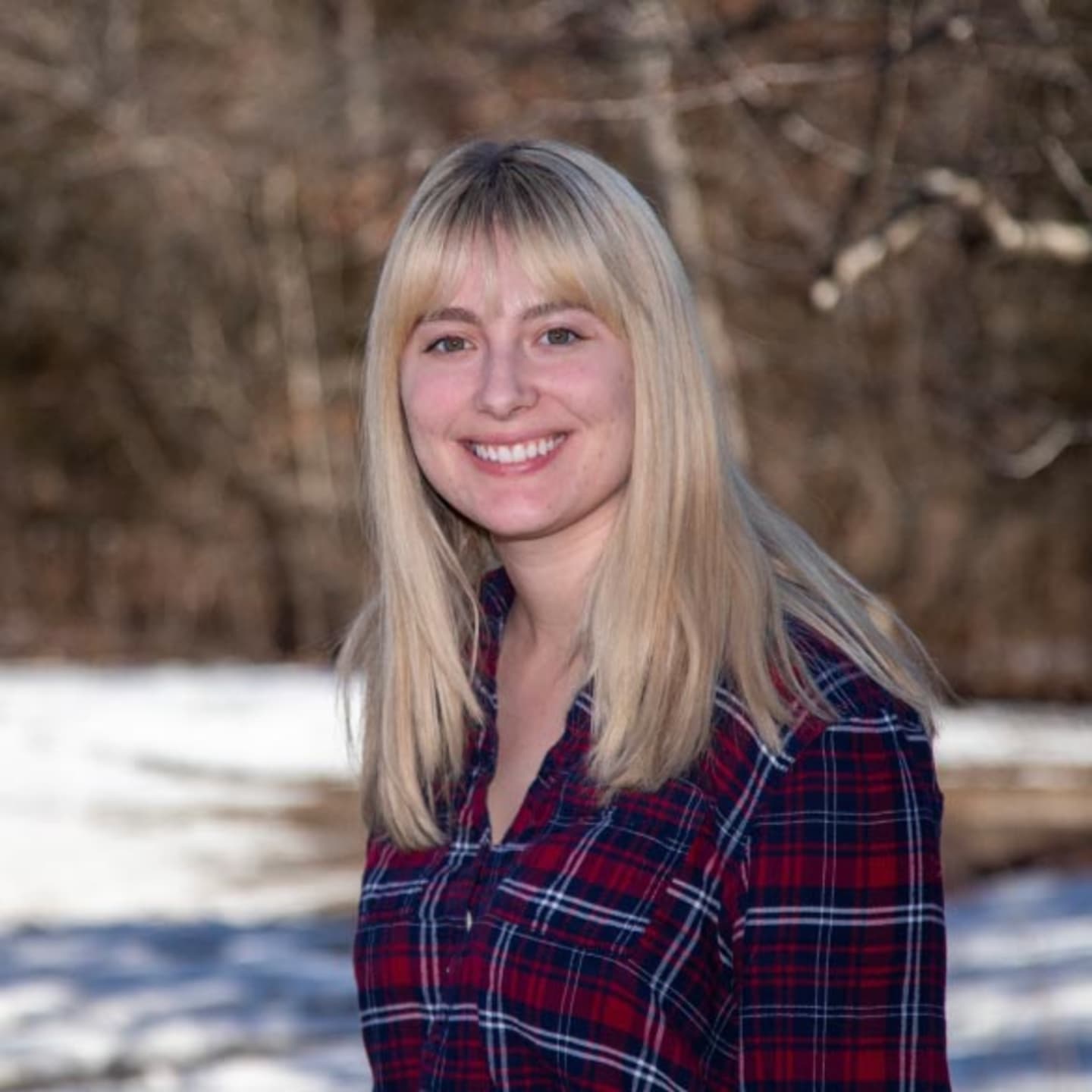 image of girl smiling with a snow backdrop