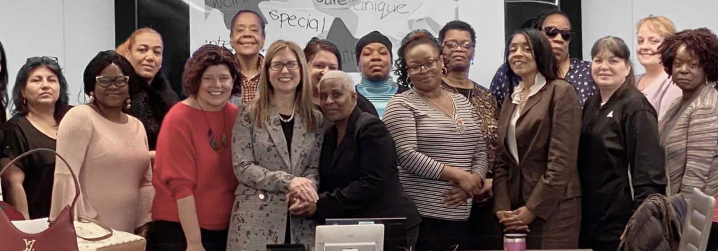 A diverse group of people attending a diversity event.