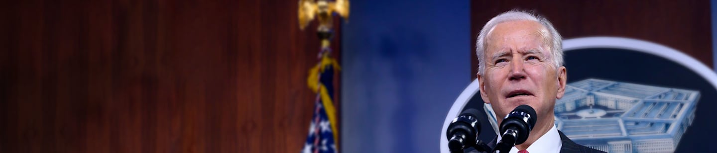 President Joe Biden speaking at a podiumm
