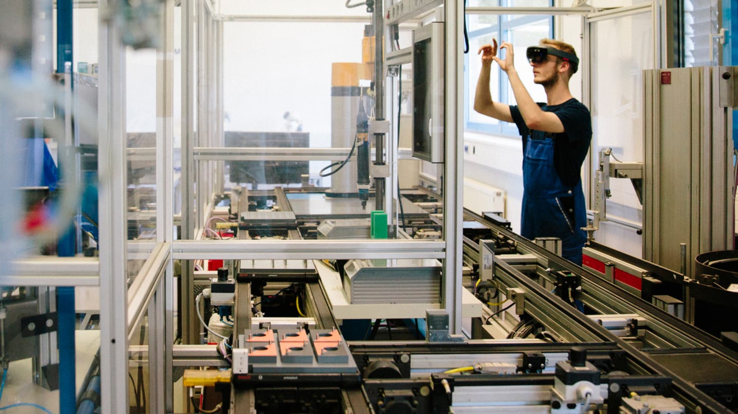 Man working in 3D printing shop.