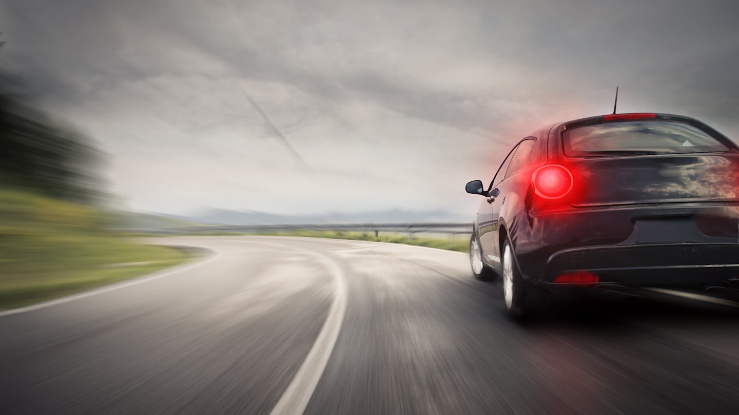 Car speeding around corner.