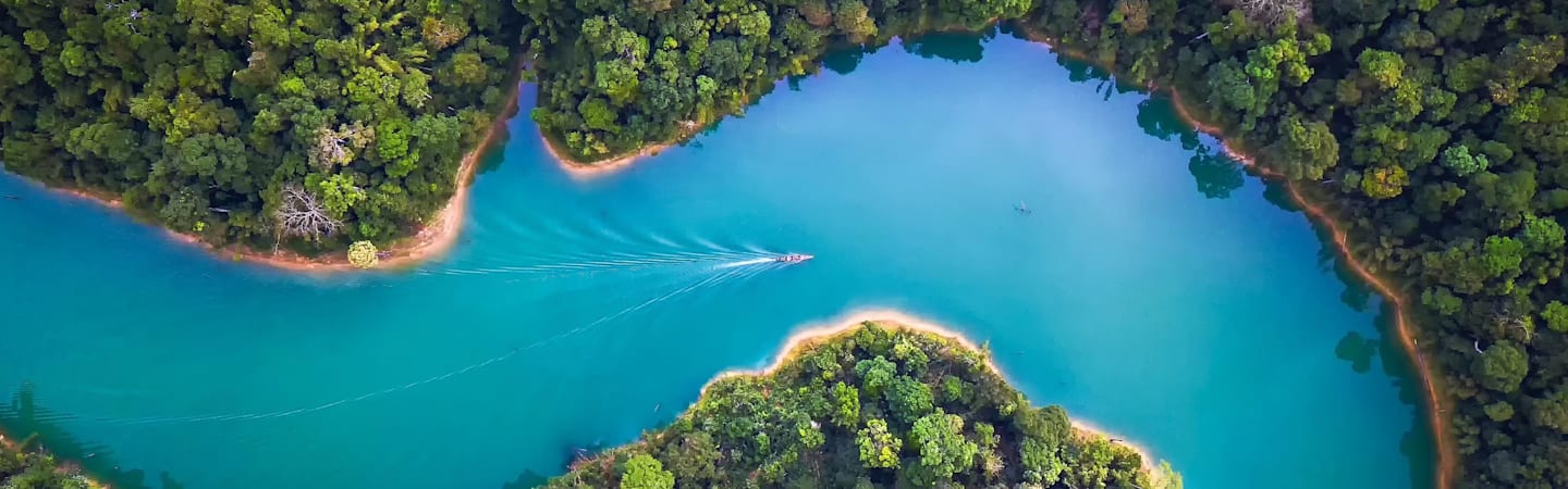 Aerial view on boat on large river.
