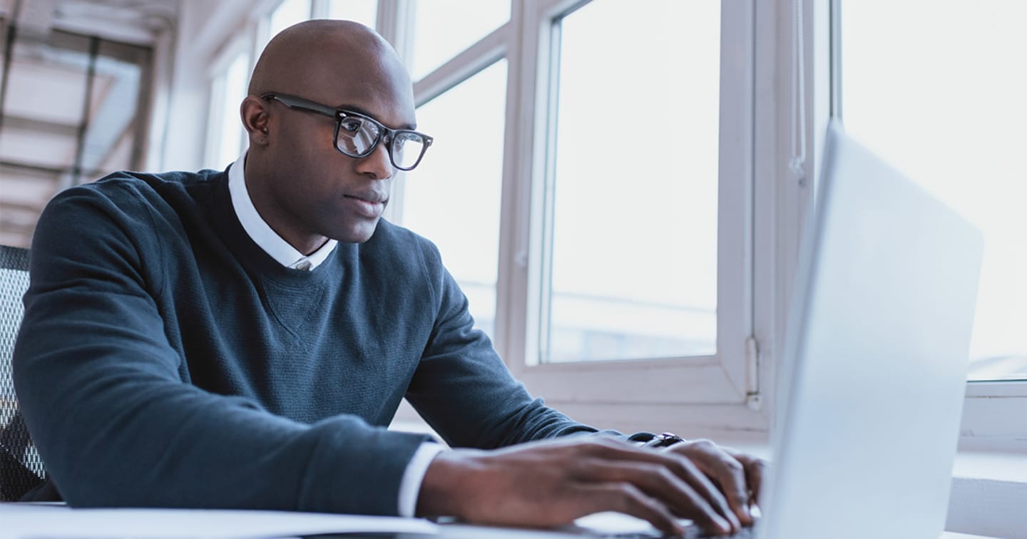 Man at computer.