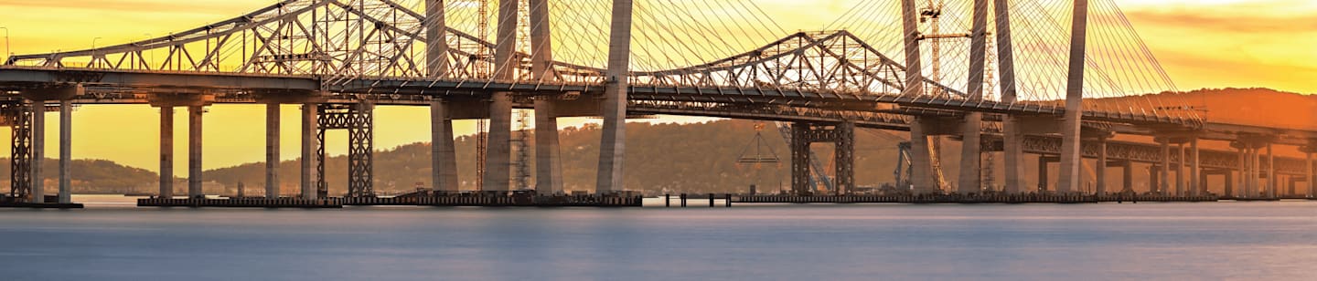 Looking at a bridge at sunrise.