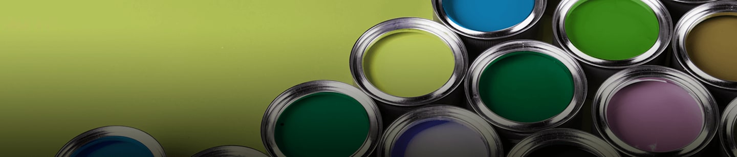 Open paint buckets in shades of green and blues.