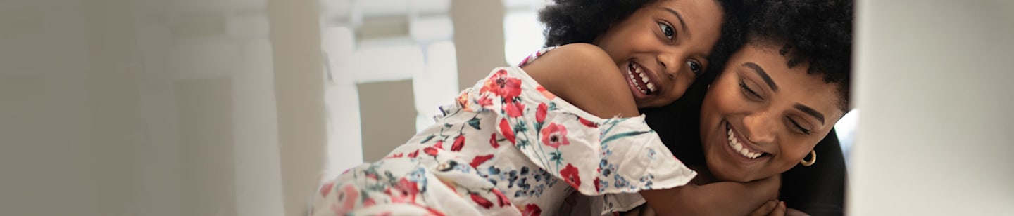 A woman and her child hugging.