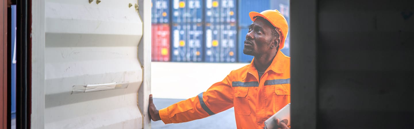 Worker examining work site.