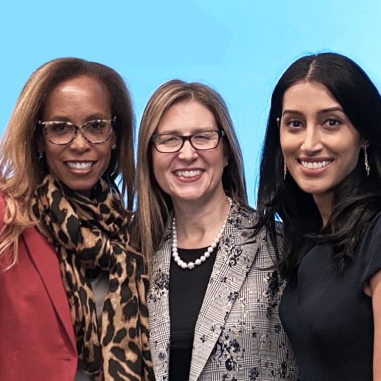 image of three women smiling together