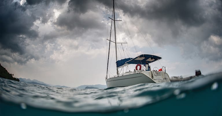 A sailboat in rough water.