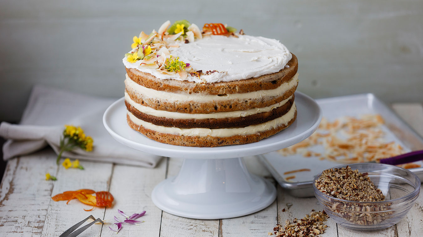 Hummingbird Cake with flowers and pecans