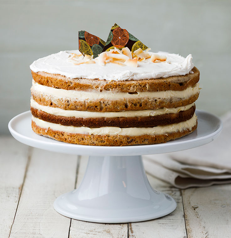 Hummingbird Cake with chocolate shards and toasted coconut flakes