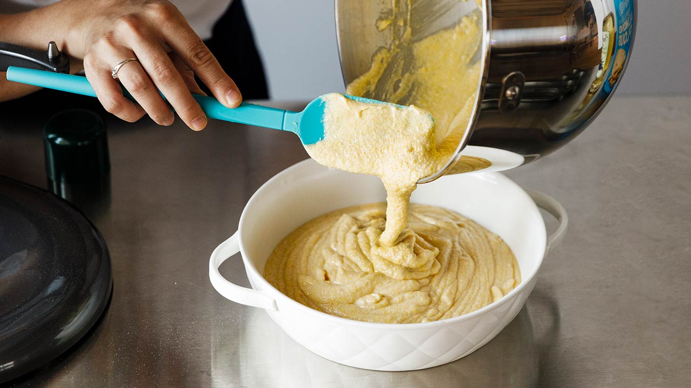 Amoretti Recipe: Gluten Free Cornbread with Sweet Corn Honey Butter. Pouring batter into our prepared pan.