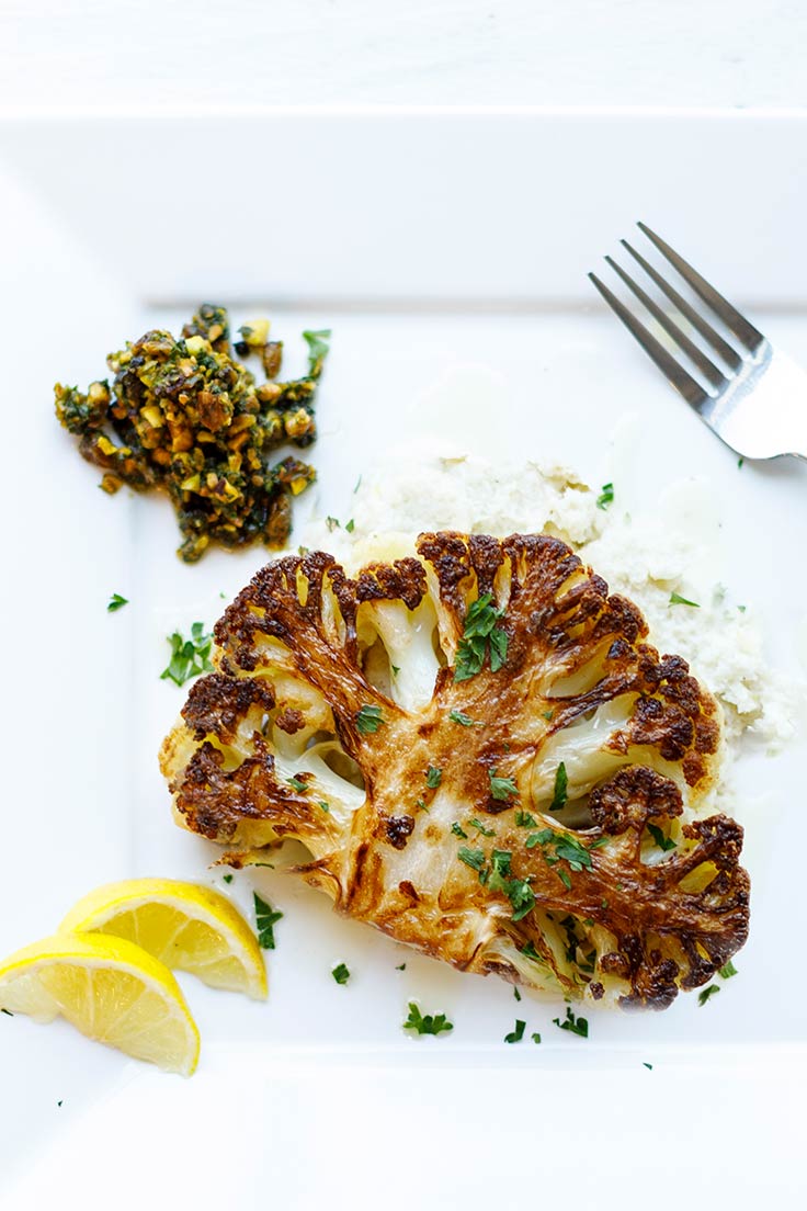 Amoretti Cauliflower Steaks with Pistachio Caper Salsa Recipe: This vegetarian main is a real people-pleaser!