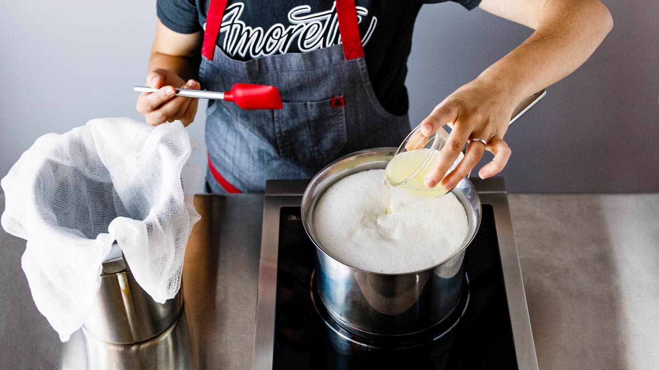 Amoretti Recipe: Homemade Ricotta. Adding lemon juice.