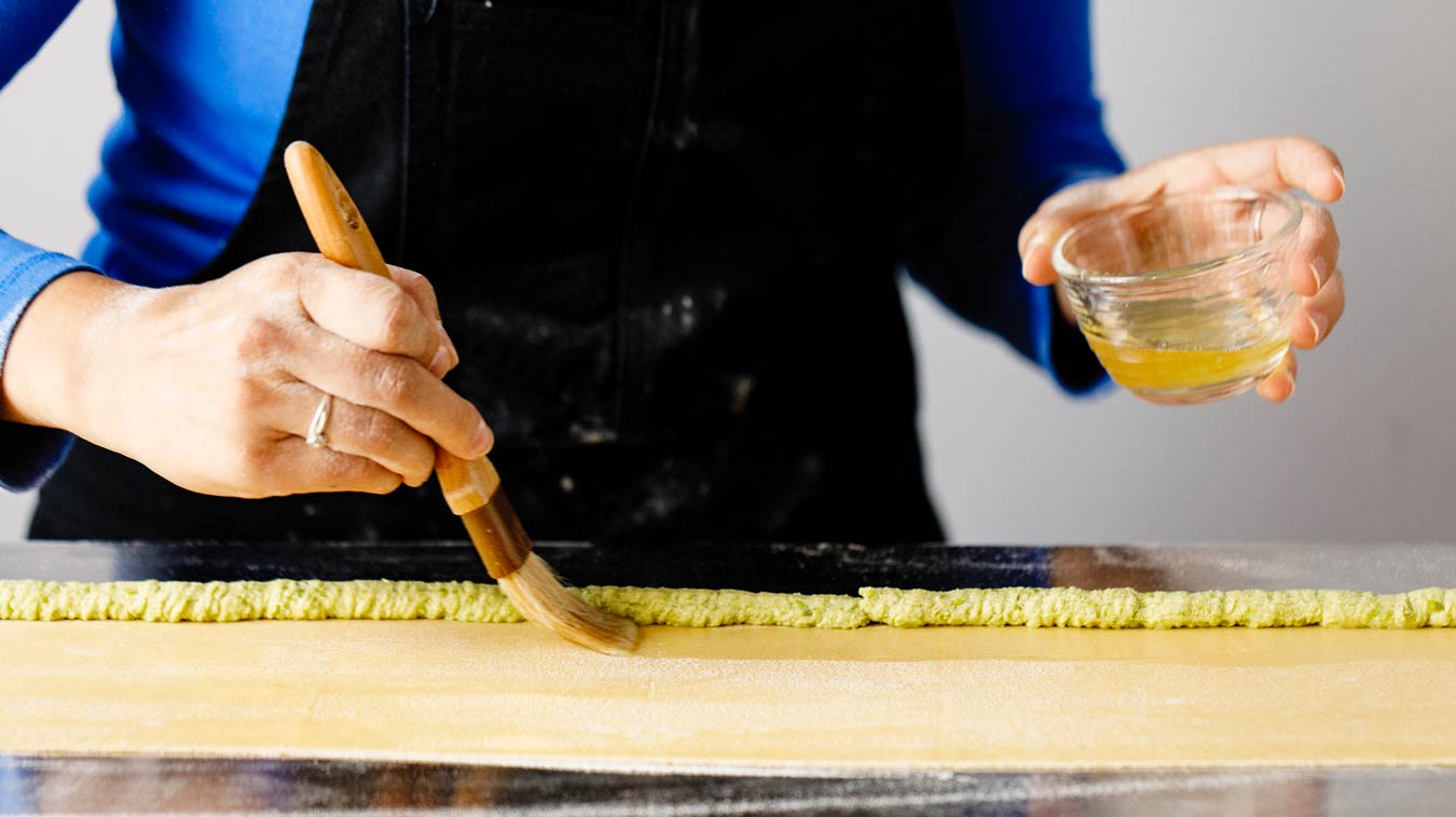 Amoretti Recipe: Agnolotti. Brush egg wash down the length of filling.