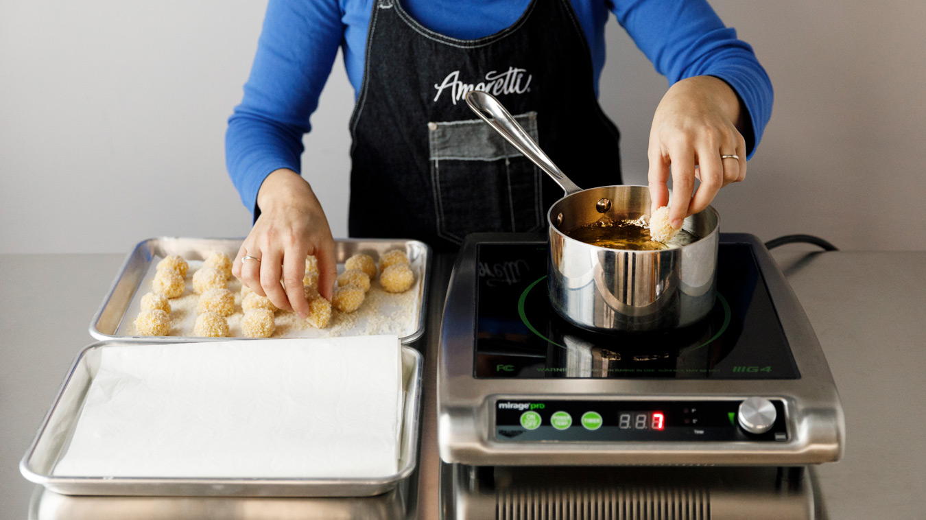 Amoretti Recipe: Horchata Arancini with Mexican Coffee Dipping Sauce. Fry arancini.