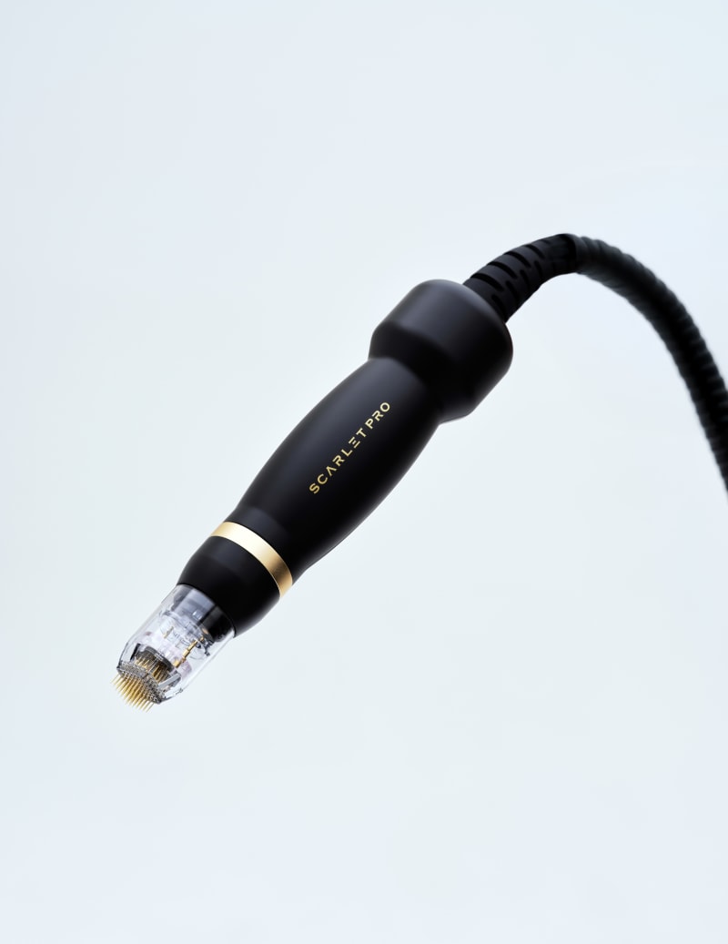 Scarlet Pro RF microneedling handpiece delivering radiofrequency energy for skin rejuvenation
