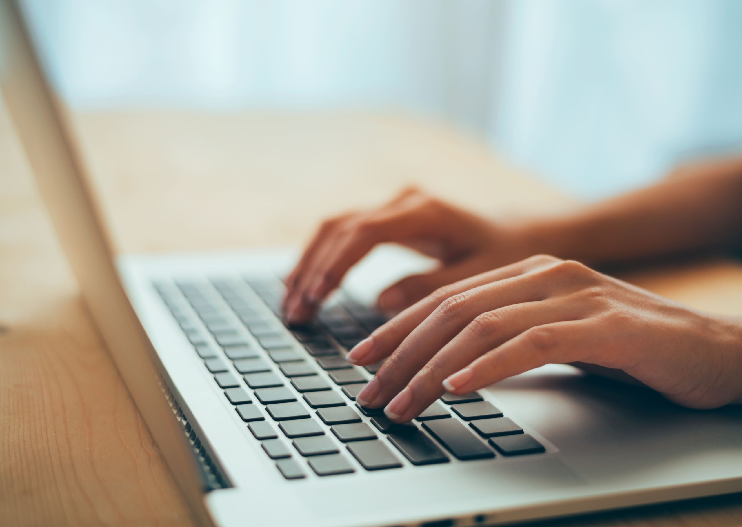 ANAGO_Education_Woman_hands_typing_laptop_564165298_300dpi.jpg