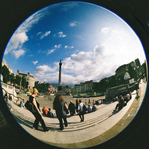 A constant flow of people. Trafalgar Square, evening sun.