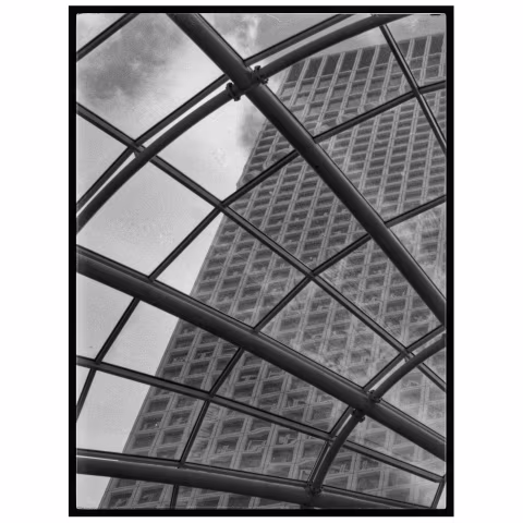 That pic was taken with my Olympus OM10 using HP5 film in the Tel Aviv mal. The view of the building anf the glass wind…