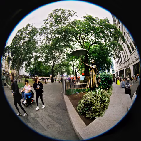 Mary Poppins statue, Leicester Square, cloudy morning light. 
