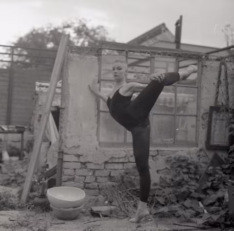 Laura, warming up against the old brick wall.